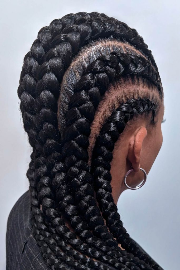 Begin braiding the cornrow like a regular plait, but after the first section, you should be adding small portions of hair on each side of the cornrow.