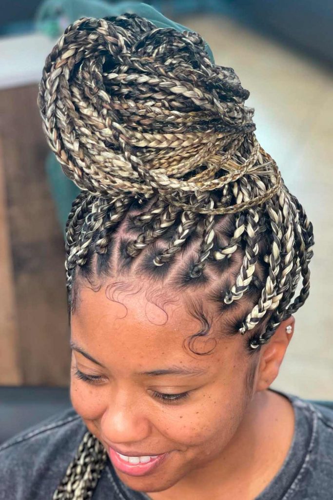 Sun-kissed Box Braids With Blond Extensions In a Bun